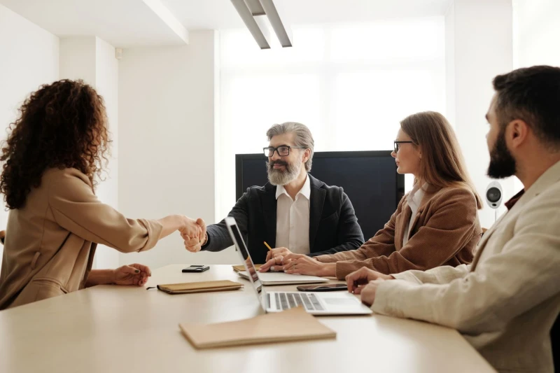 A hiring conversation reaching agreement across a meeting table